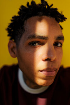 Man with dreadlocks looking at camera