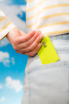 Green contactless card in back pocket