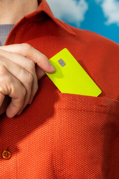 Green bank card in shirt pocket