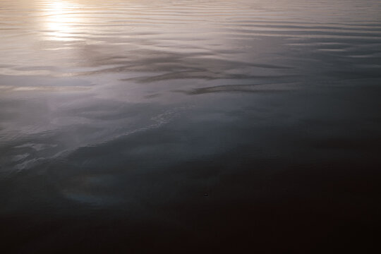 Wet sand reflections at sunset