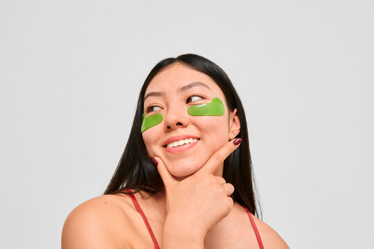 Playful skincare moment with under-eye patches