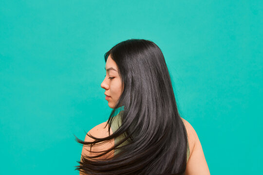 Woman with long black hair in motion