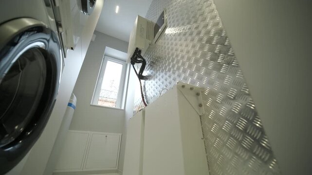 Home solar battery storage module with power cables and connectors.