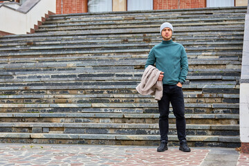 Man stands calmly on wide stone steps © Iurii Gagarin