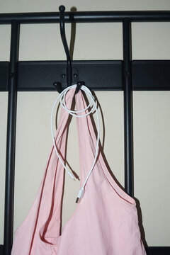 Charging cable looped on a hanger