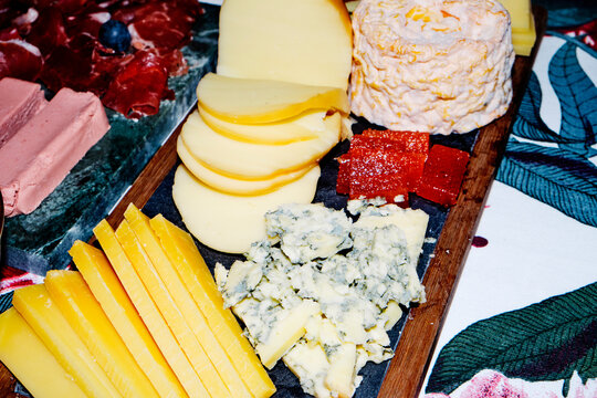 close-up of a prepared table with cheeses, ham and terrine