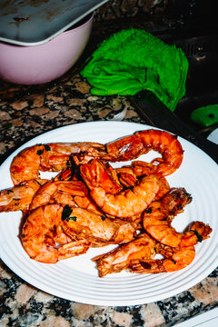 pan fried prawns with garlic and parsley on a kitchen counter
