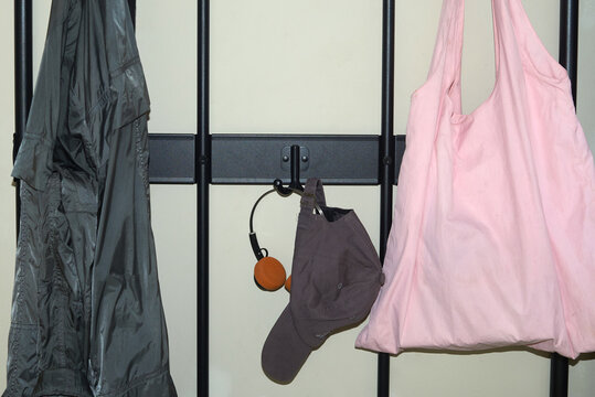 Clothes hanging on rack in indoor space 