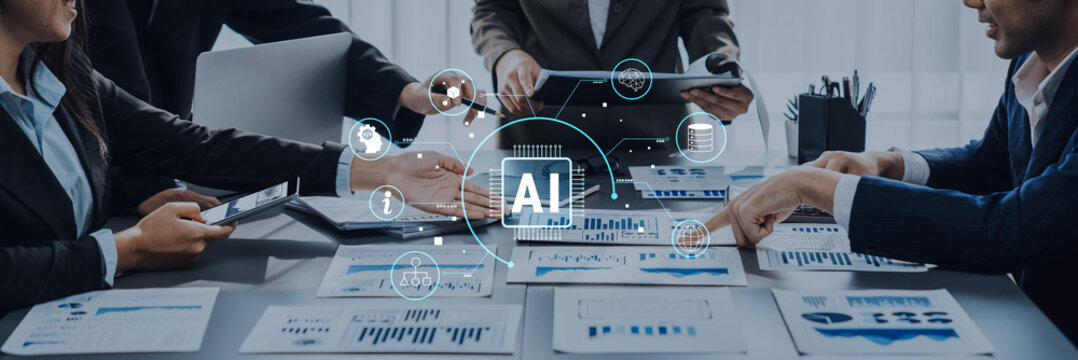 A diverse business team collaborates in a modern office, using charts and technology to discuss AI strategies and innovations, fostering effective teamwork and planning. Trope
