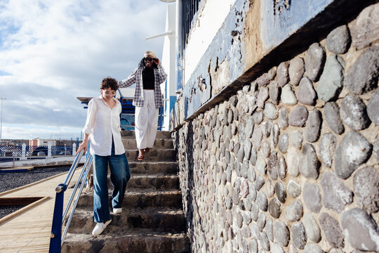 Women friends walking down stairs in Gran Canaria