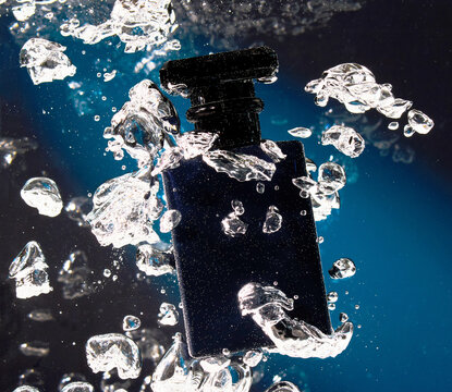 Underwater Perfume Shot with Bubbles 