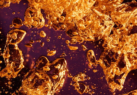 Gold Color Water Bubbles in Abstract Shapes Purple Background 