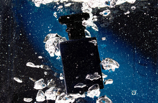 Still Life Underwater Perfume Shot with Bubbles 