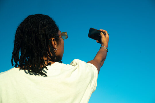Beautiful black woman taking selfie