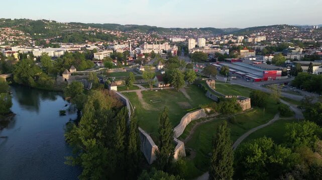 Aerial perspective showcases river Vrbas and medieval fortification in Banja Luka, Bosnia and Herzegovina.