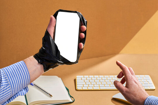 Man Holds Phone Taped to Hand to Show Endless Screen Time Concept
