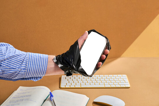 Man Holds Phone Taped to Hand to Show Endless Screen Time Concept