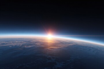 Sun peeking above earth's limb over planet horizon in space