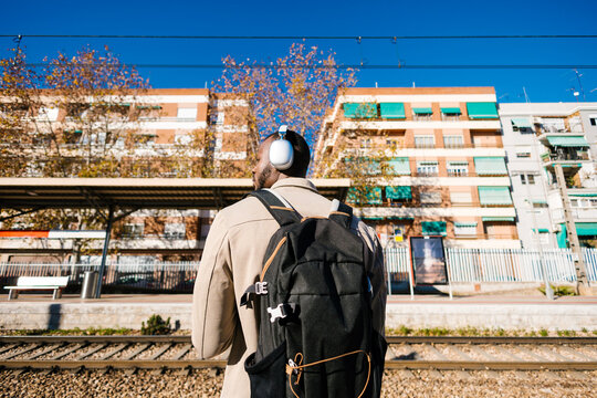 Man waiting at the train station.