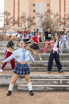 Students dancing across school stands at different levels