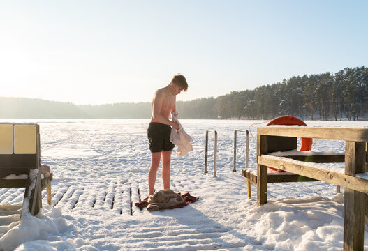 Man Get Dressed After Bathing In The Ice Hole
