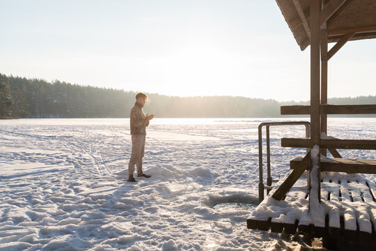 Man Preparing For Bathing In The Ice Hole