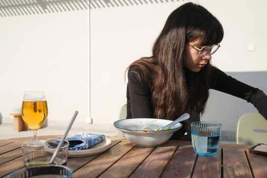 Lunch on a sunny afternoon with food and drinks on a table