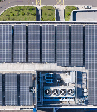 Solar Panels on Industrial Rooftop Aerial View