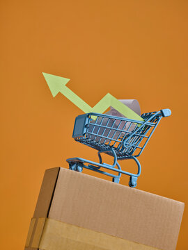 Shopping cart with an upward arrow symbolizing growth and success