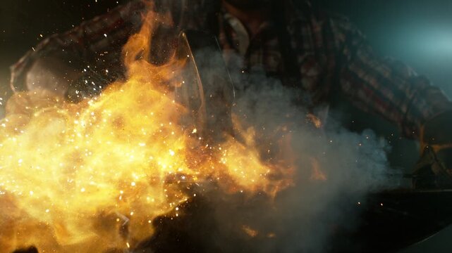 Cinematic close-up of blacksmith forging glowing hot iron on anvil with sparks flying. Shot in dramatic lighting on dark background with high-speed camera at 1000fps. Camera in motion.