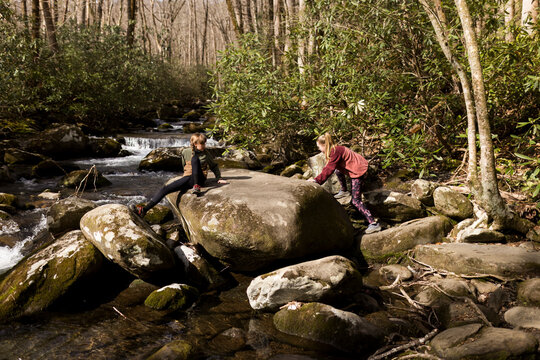 Climbing on the stream boulders. 