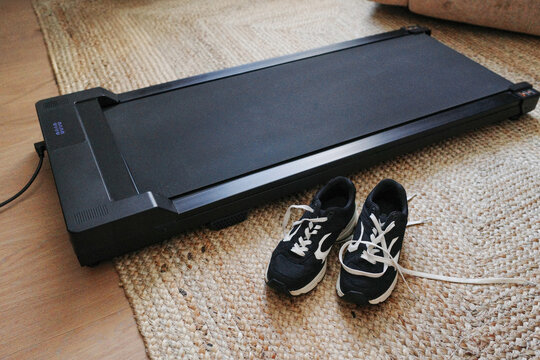 Treadmill and sneakers ready for home workout