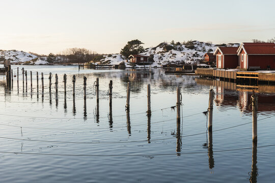 Tranquil Winter Harbor with Traditional Fishing Huts
