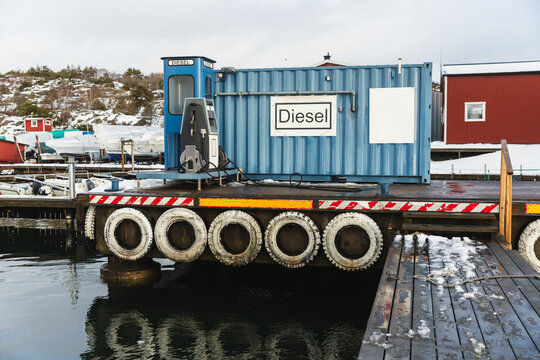 Blue Diesel Fuel Station Container in a Snowy Swedish Fishing Port