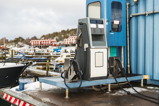Blue Diesel Fuel Station Container in a Snowy Swedish Fishing Port