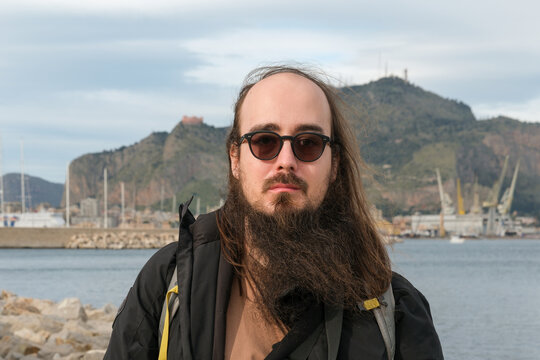 Man Standing by the Sea