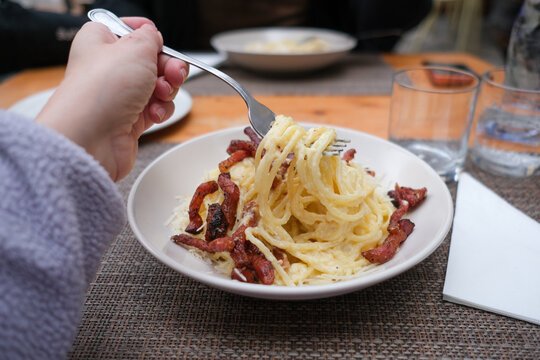Eating Pasta at Outdoor Table