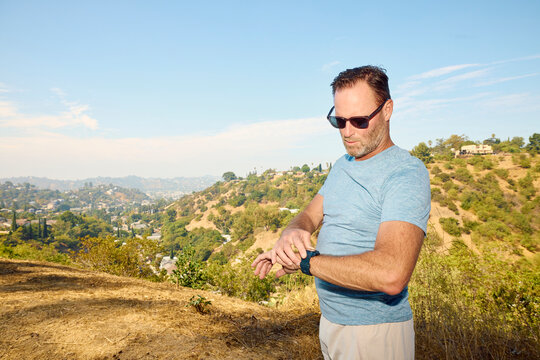 Active man checks the pace on his watch