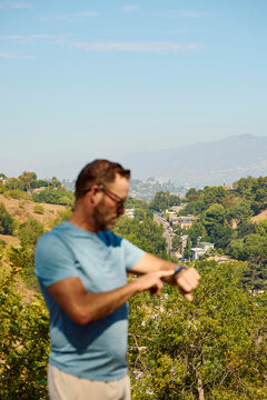 Active man checks the pace on his watch