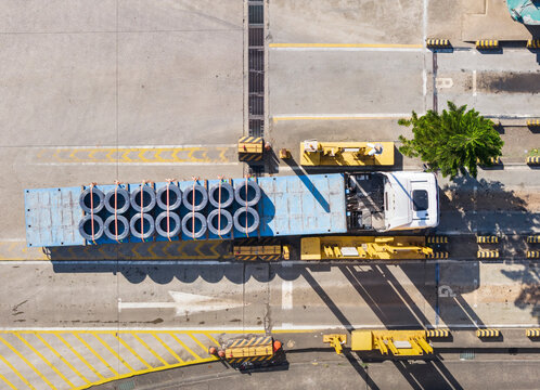 Aerial Shot of Truck Transporting Steel Coils in Industrial Zone