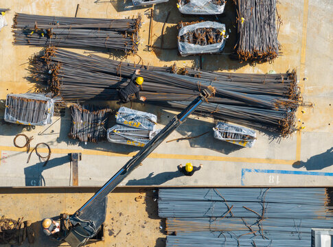 Aerial View of Construction Site with Workers and Steel Rebar