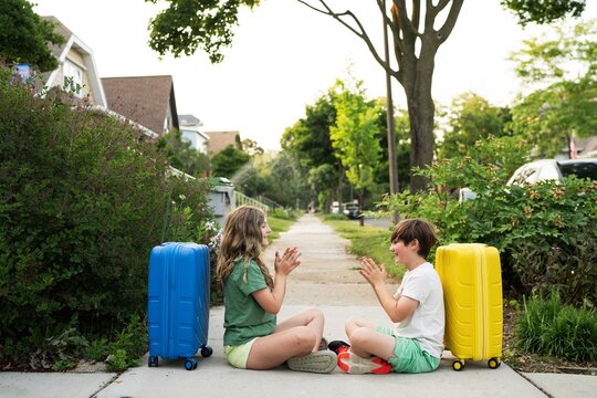 Kids Playing with Luggage