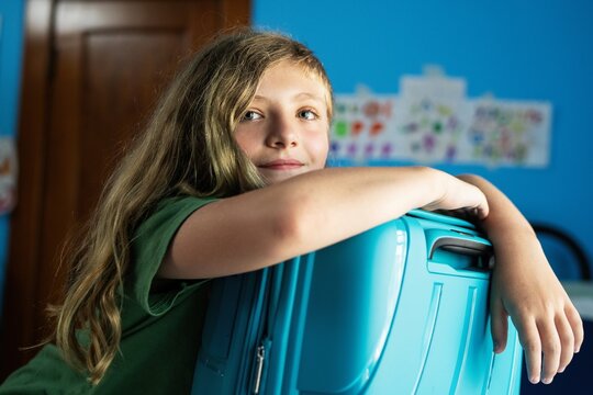 Girl with Blue Suitcase