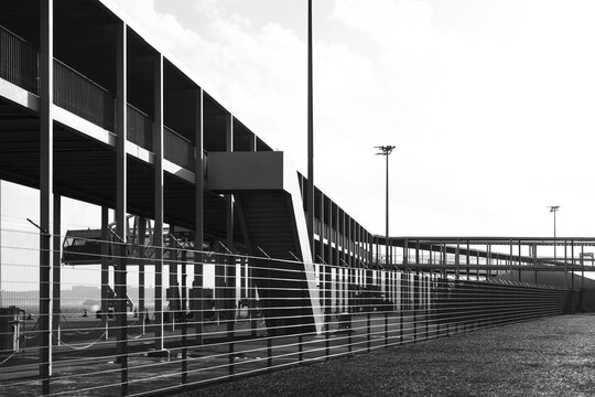 Modern architectural walkway with fenced structure