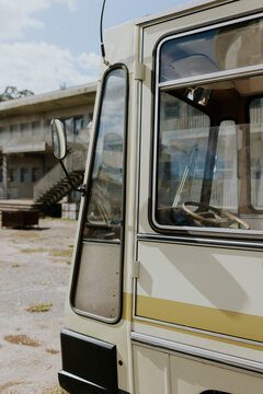Vintage bus with weathered building backdrop