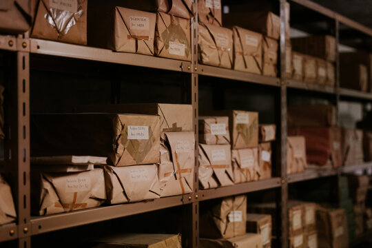 Brown paper packages on industrial storage shelves