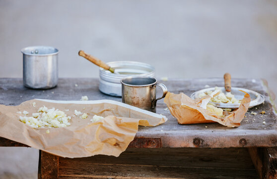 Rustic outdoor wooden table with food preparation