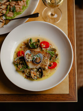 White fish with mussels and cous cous