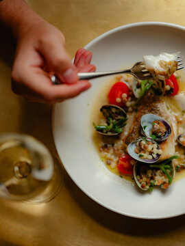White fish with mussels and cous cous