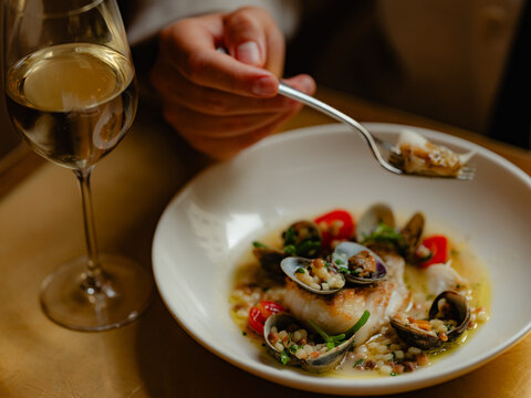 White fish with mussels and cous cous